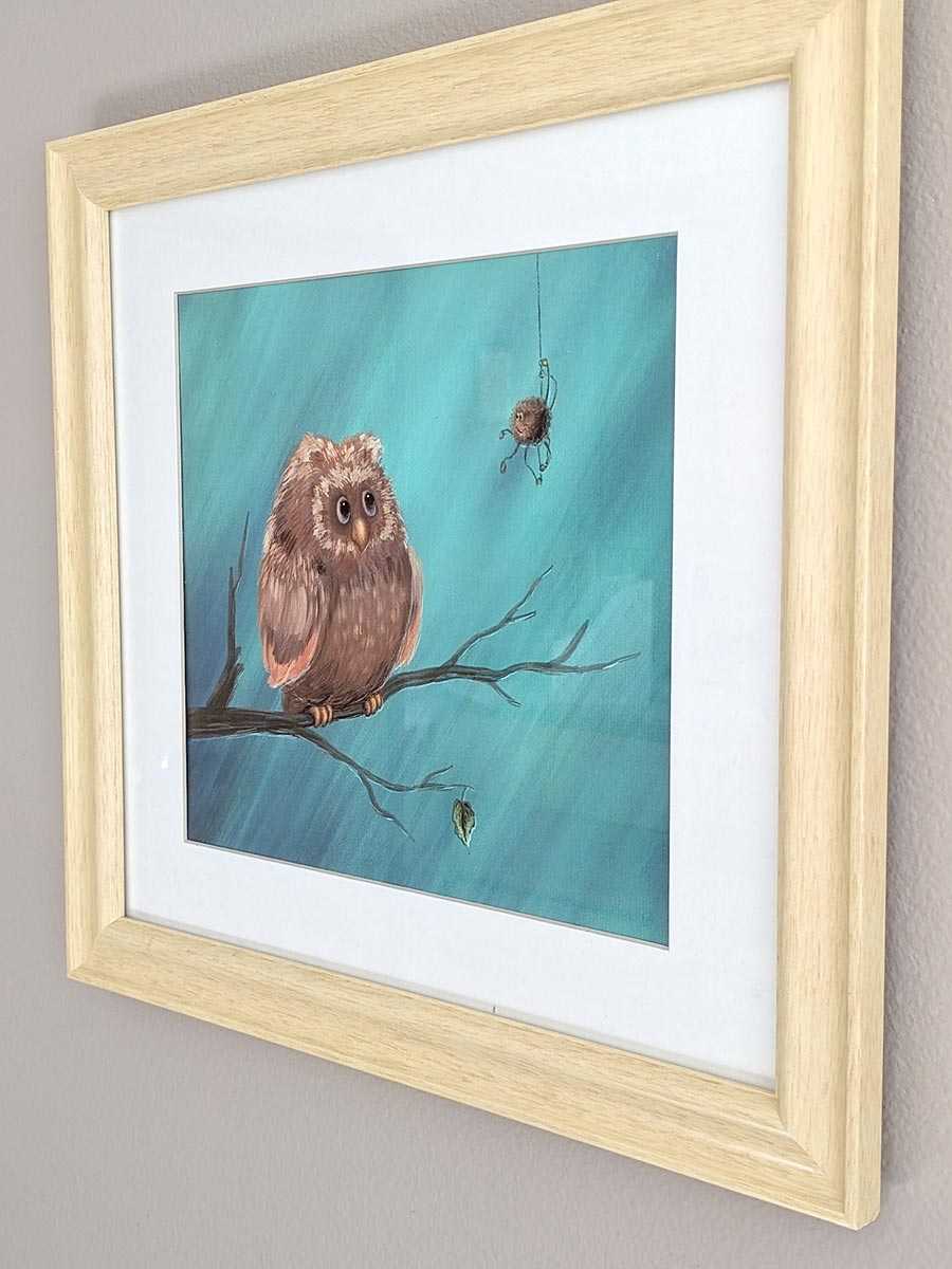 Owl with a spider