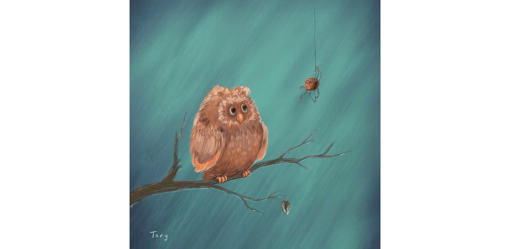 Owl with a spider